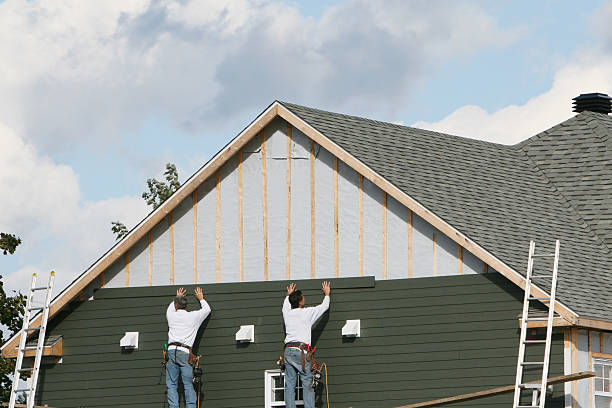 Professional Siding Contractor technician working in Spring House, PA